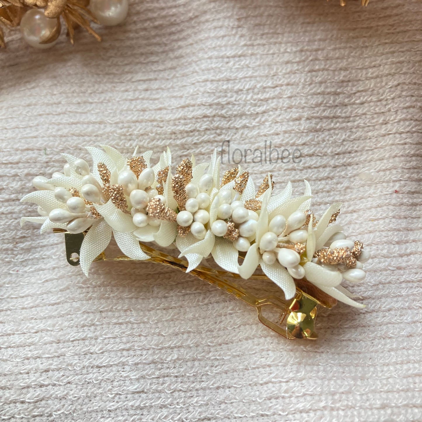 White and golden floral barrette clip