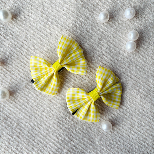 Yellow bow alligator clips