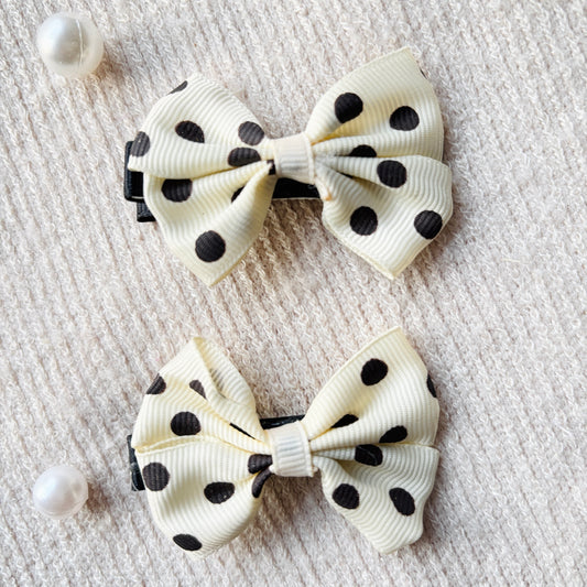 Cream polka bow alligator clips